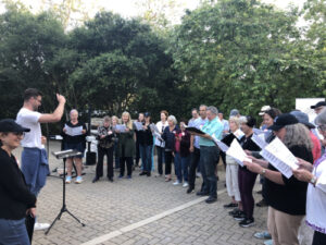SB Choral group singing at oak park