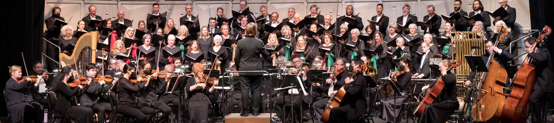 Jo Anne Wasserman stands in front, conducting the SB Choral Society during the Hallelujah Project Concert