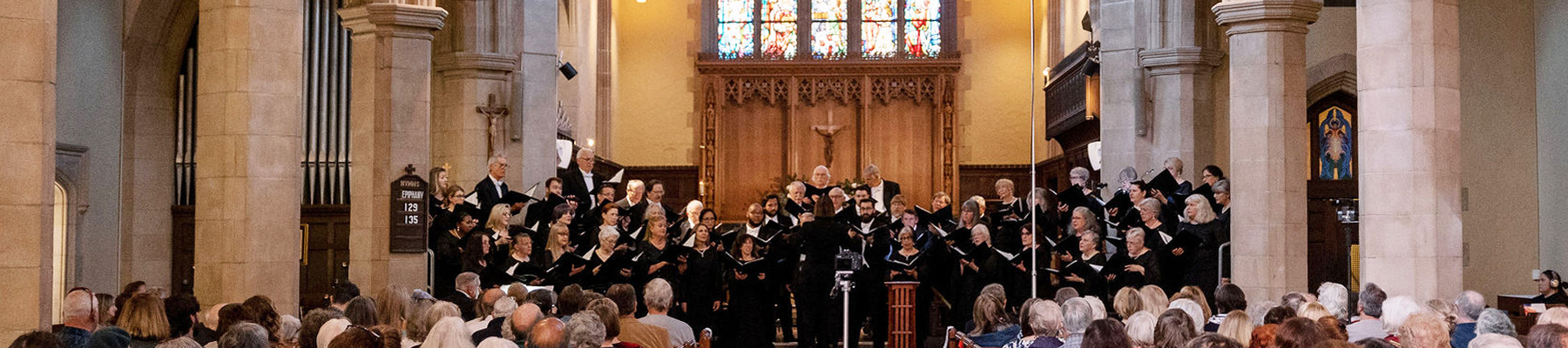 SB Choral members singing in a church