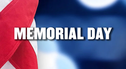 Memorial Day in all caps and white with a background of the red, white, blue of an American flag